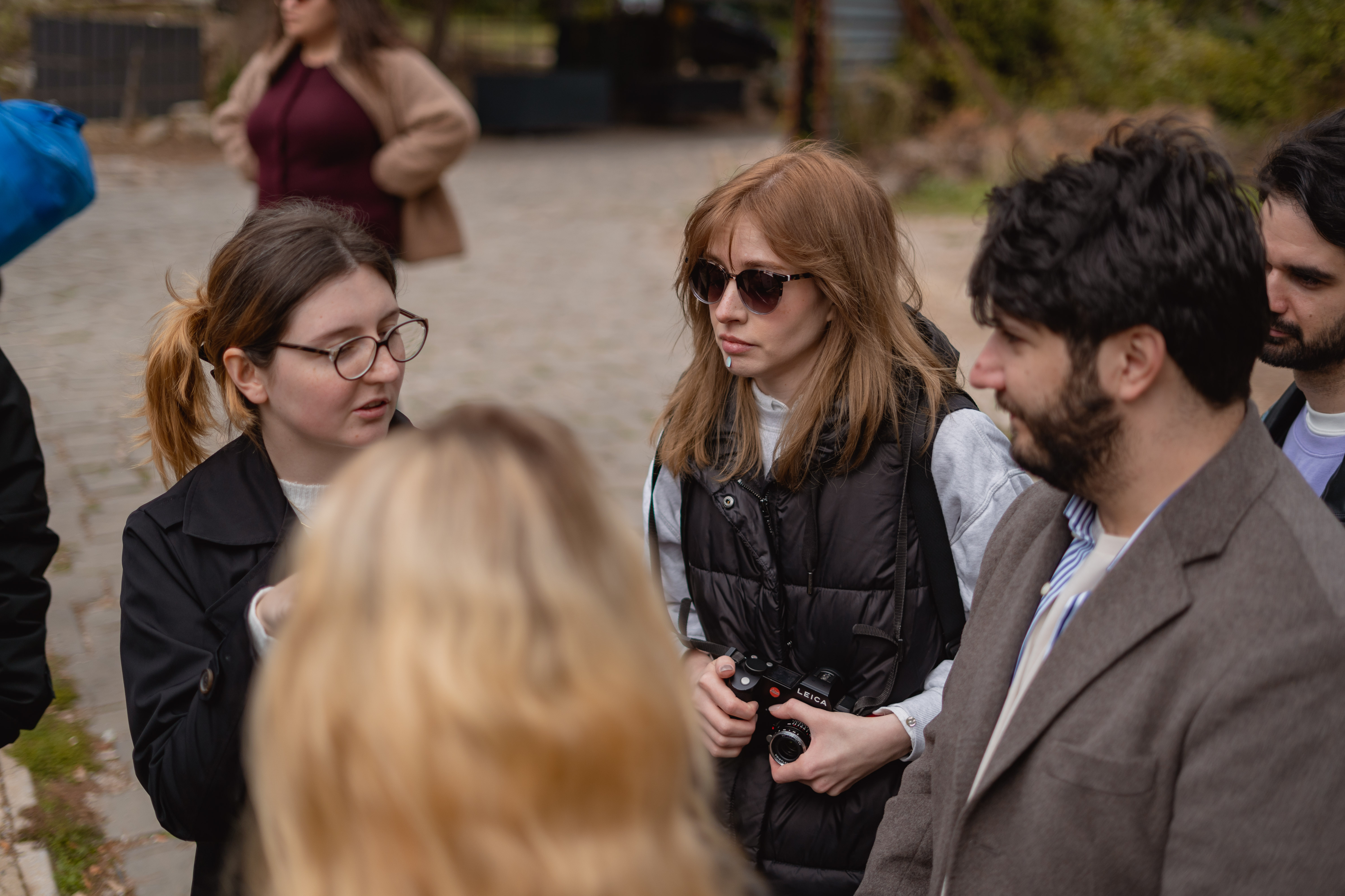 The Pistacio team in conversation outdoors on a spring afternoon.